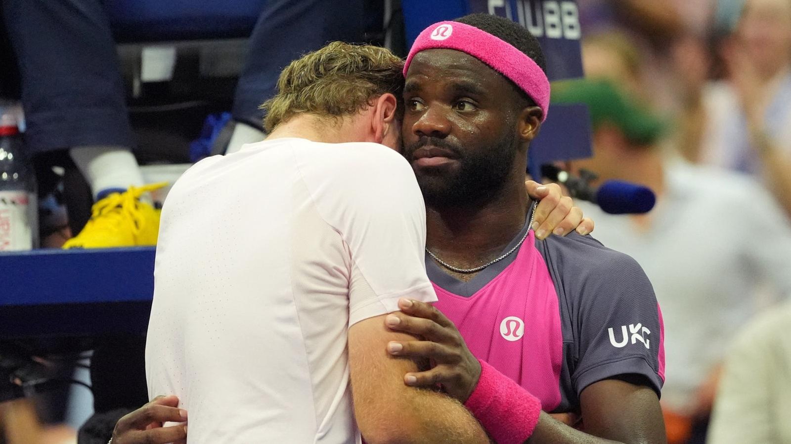 Frances Tiafoe hugs Alex Michelsen at the net after the US Open quarter-final. Reuters still via BBC Sport.